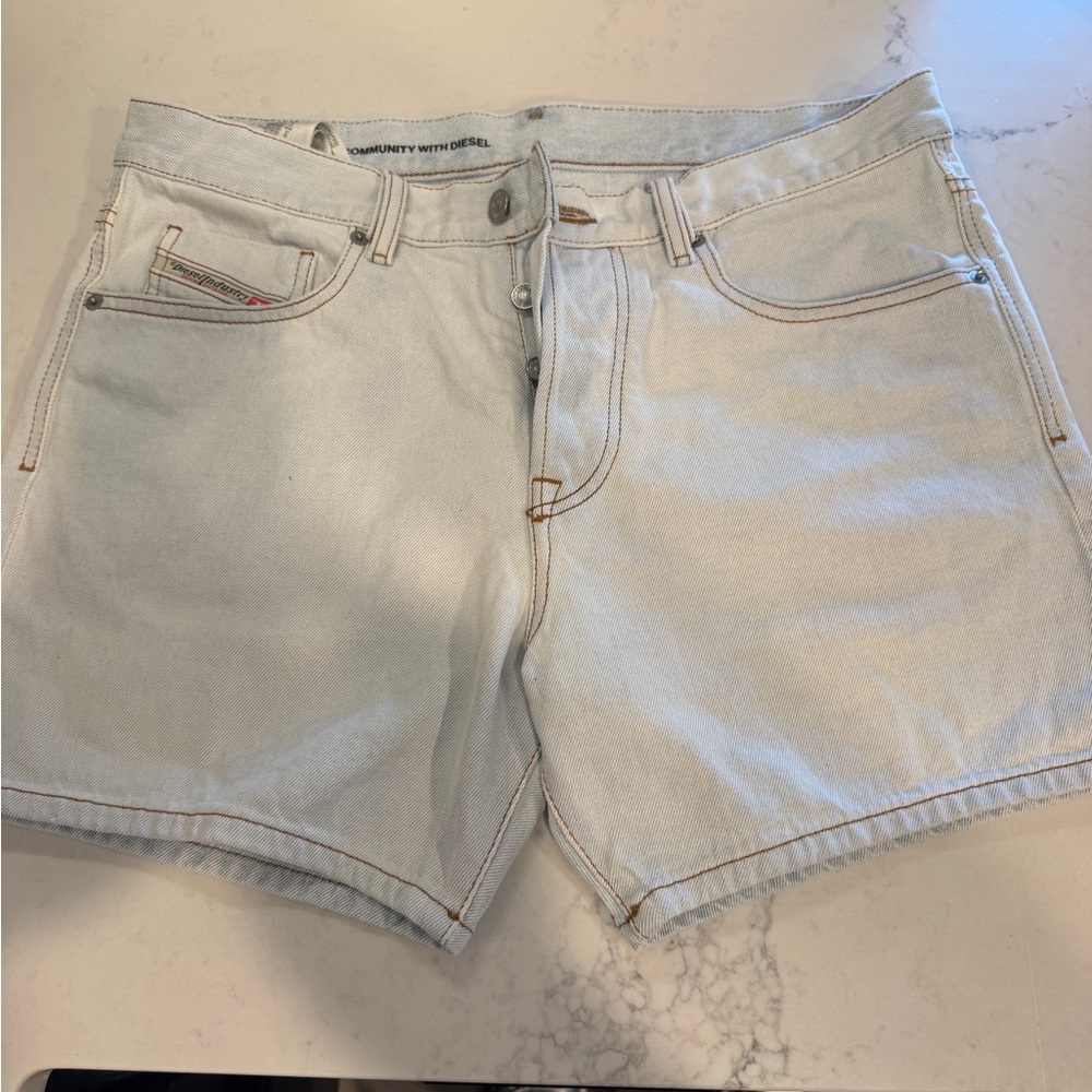 NWOT Men’s Diesel x Tom of Finland pale blue denim shorts.